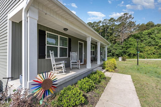 18 Hunter Fox Trl, Angier, NC 27501 - view of side of property featuring covered porch and a lawn