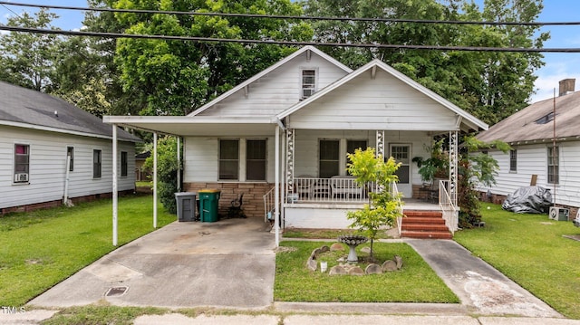 517 E 14th St, Lumberton, NC 28358 - bungalow-style house featuring a porch and a front lawn