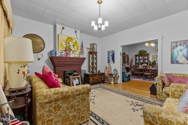 517 E 14th St, Lumberton, NC 28358 - living area with a chandelier and a brick fireplace