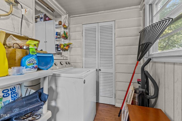 517 E 14th St, Lumberton, NC 28358 - laundry room with washer / dryer, cabinet space, and wood finished floors