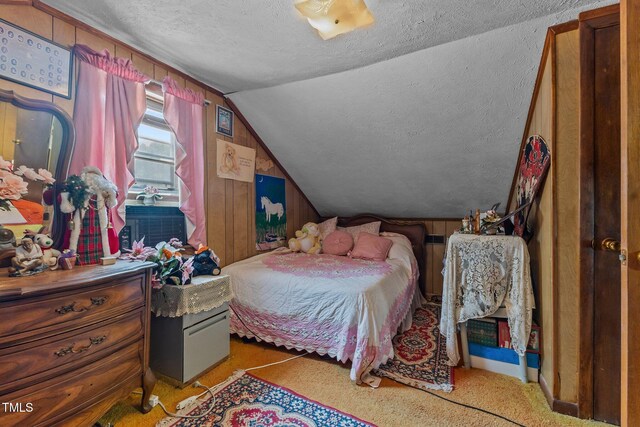 517 E 14th St, Lumberton, NC 28358 - bedroom with vaulted ceiling, a textured ceiling, and carpet flooring
