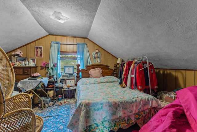 517 E 14th St, Lumberton, NC 28358 - bedroom with a textured ceiling, lofted ceiling, and wood walls