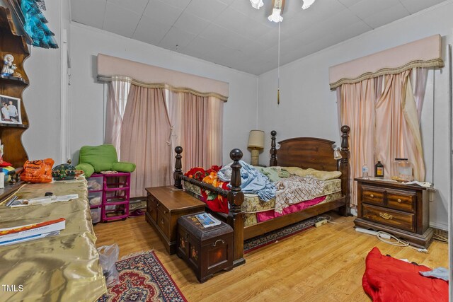 517 E 14th St, Lumberton, NC 28358 - bedroom with ornamental molding and light wood-style flooring