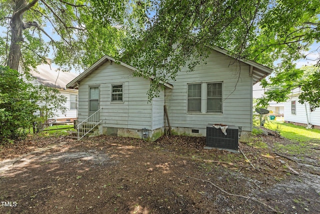 517 E 14th St, Lumberton, NC 28358 - rear view of property featuring cooling unit, crawl space, and entry steps