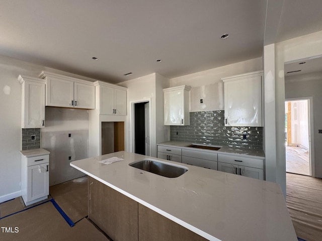 252 Meadowbark Bnd Unit 46, Garner, NC 27529 - kitchen with white cabinetry, backsplash, and recessed lighting