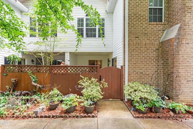 320 Summerwalk Cir, Chapel Hill, NC 27517 - doorway to property featuring a gate and brick siding