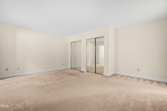 320 Summerwalk Cir, Chapel Hill, NC 27517 - unfurnished bedroom with multiple closets, light colored carpet, and baseboards