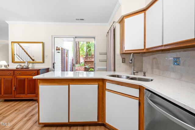320 Summerwalk Cir, Chapel Hill, NC 27517 - kitchen featuring stainless steel dishwasher, a sink, crown molding, backsplash, and a peninsula