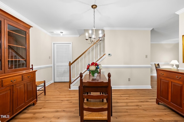 320 Summerwalk Cir, Chapel Hill, NC 27517 - dining space with a chandelier, light wood finished floors, baseboards, ornamental molding, and stairs