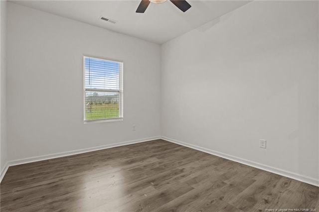 40 Arlie Ln, Lillington, NC 27546 - unfurnished room featuring ceiling fan, dark wood-style flooring, and baseboards