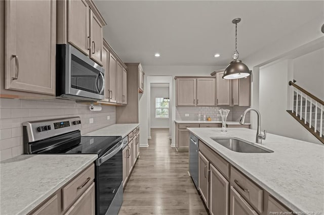 40 Arlie Ln, Lillington, NC 27546 - kitchen featuring appliances with stainless steel finishes, a sink, recessed lighting, backsplash, and wood finished floors