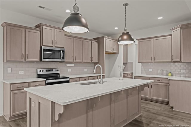 40 Arlie Ln, Lillington, NC 27546 - kitchen with stainless steel appliances, a sink, decorative backsplash, recessed lighting, and dark wood-type flooring