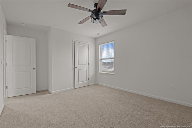 40 Arlie Ln, Lillington, NC 27546 - unfurnished bedroom with light colored carpet, baseboards, and a ceiling fan