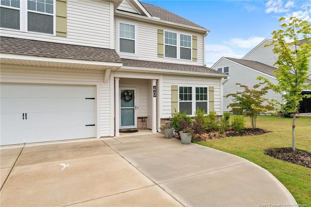 40 Arlie Ln, Lillington, NC 27546 - view of front of home with a front lawn, roof with shingles, and driveway