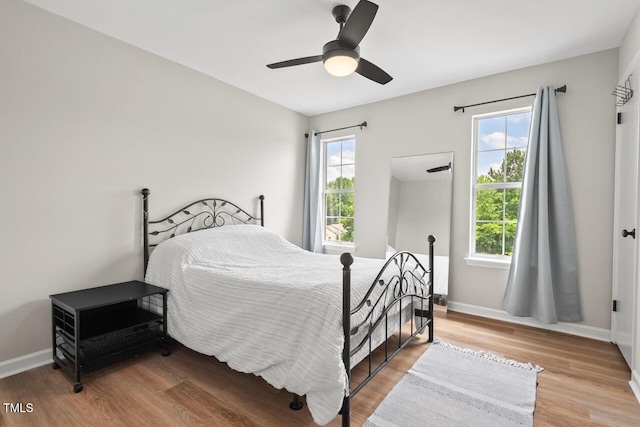 411 Buxton St, Durham, NC 27713 - bedroom with multiple windows, wood finished floors, and ceiling fan