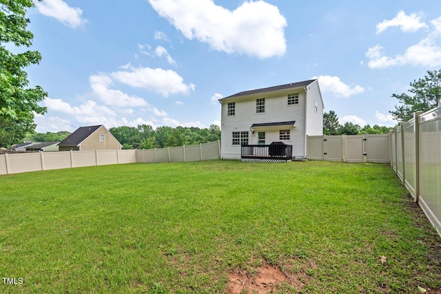 411 Buxton St, Durham, NC 27713 - back of property with a gate, a fenced backyard, and a wooden deck