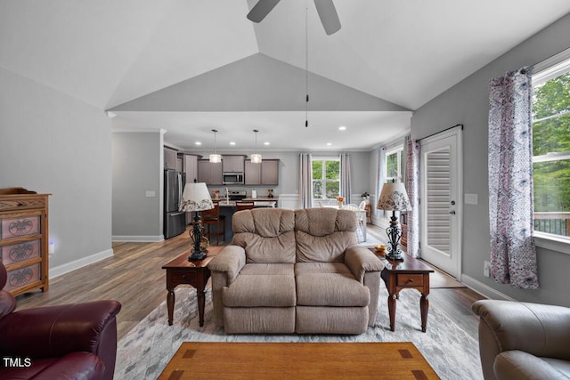 50 Harriet Gentry Ln, Timberlake, NC 27583 - living room featuring light wood finished floors, vaulted ceiling, ceiling fan, recessed lighting, and baseboards