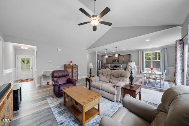 50 Harriet Gentry Ln, Timberlake, NC 27583 - living area with vaulted ceiling, ceiling fan, a wainscoted wall, light wood-type flooring, and recessed lighting