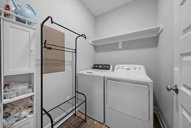 50 Harriet Gentry Ln, Timberlake, NC 27583 - laundry room with independent washer and dryer and wood finished floors