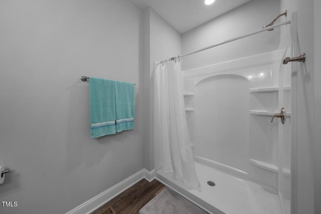 50 Harriet Gentry Ln, Timberlake, NC 27583 - bathroom with a shower with curtain, wood finished floors, and baseboards