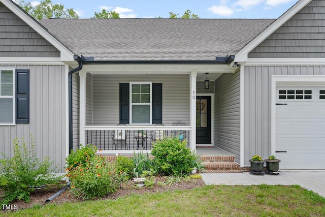 50 Harriet Gentry Ln, Timberlake, NC 27583 - doorway to property with a porch, a garage, a shingled roof, and board and batten siding