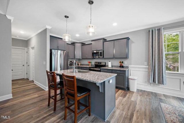 50 Harriet Gentry Ln, Timberlake, NC 27583 - kitchen with appliances with stainless steel finishes, a sink, crown molding, light stone countertops, and wood finished floors