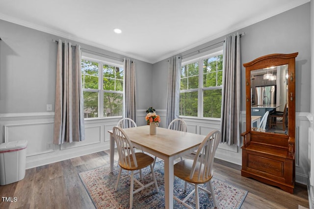 50 Harriet Gentry Ln, Timberlake, NC 27583 - dining area with plenty of natural light, ornamental molding, a wainscoted wall, a decorative wall, and wood finished floors
