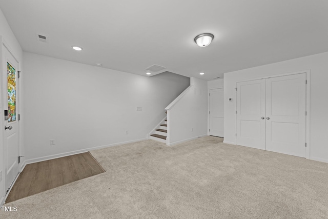 447 N Fisher St, Raleigh, NC 27610 - below grade area with carpet floors, stairs, baseboards, and recessed lighting