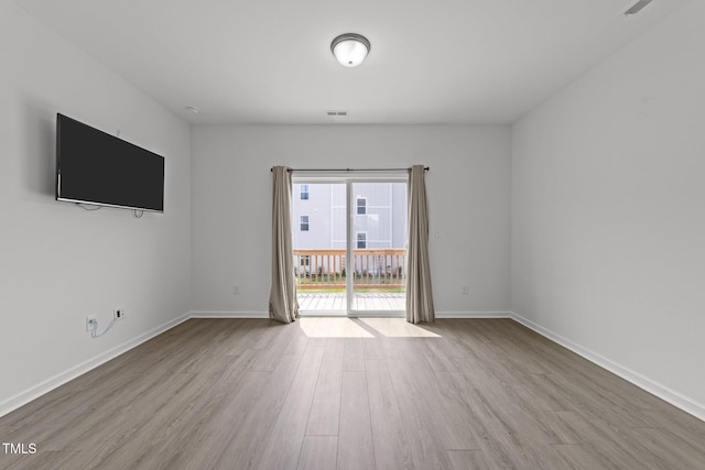 447 N Fisher St, Raleigh, NC 27610 - empty room with wood finished floors and baseboards