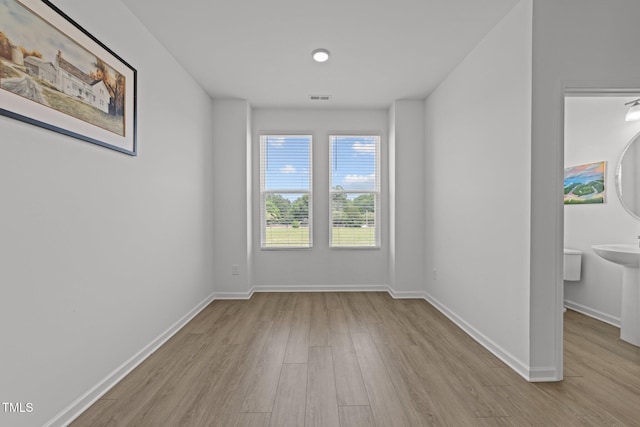 447 N Fisher St, Raleigh, NC 27610 - empty room with wood finished floors and baseboards