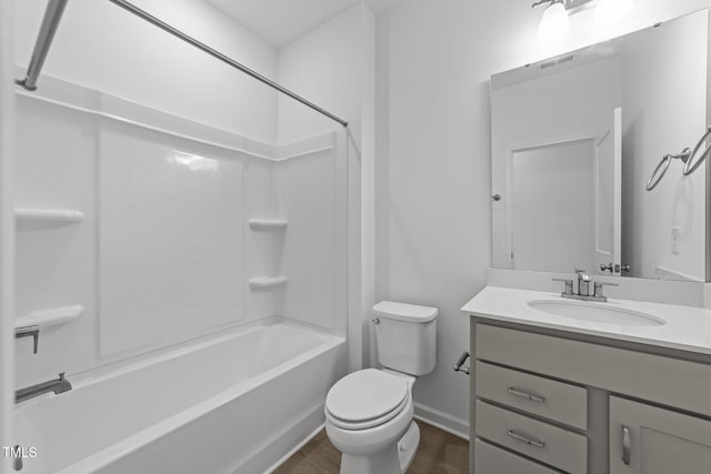 447 N Fisher St, Raleigh, NC 27610 - full bath featuring vanity, wood finished floors, toilet, shower / tub combination, and baseboards
