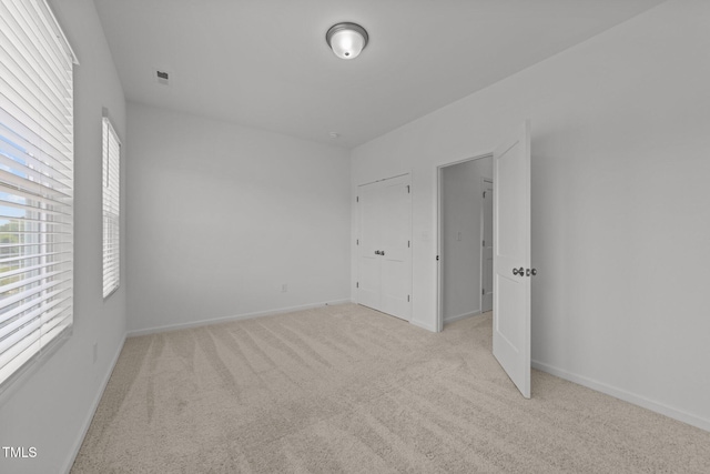 447 N Fisher St, Raleigh, NC 27610 - unfurnished bedroom with light carpet and baseboards