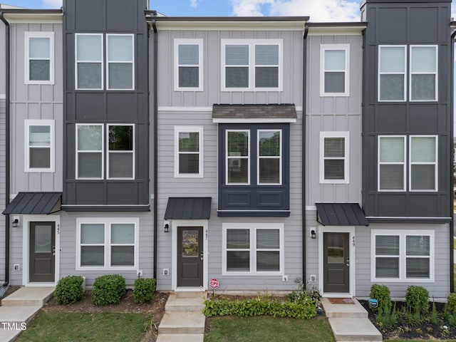 447 N Fisher St, Raleigh, NC 27610 - multi unit property with board and batten siding, a standing seam roof, and metal roof