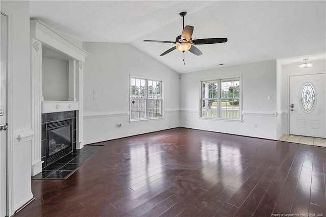 120 Wood Valley Ln, Raeford, NC 29376 - unfurnished living room with ceiling fan, a tile fireplace, vaulted ceiling, and wood finished floors
