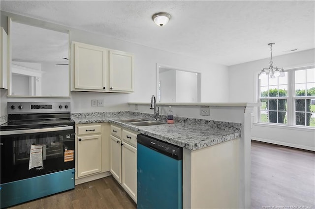 120 Wood Valley Ln, Raeford, NC 29376 - kitchen featuring dishwasher, stainless steel range with electric stovetop, a sink, a peninsula, and dark wood finished floors