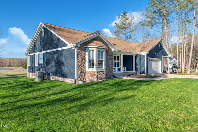 390 Lake Magnolia Way, Smithfield, NC 27577 - view of front of home featuring a garage, central AC unit, and a front lawn