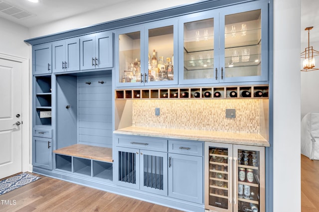 390 Lake Magnolia Way, Smithfield, NC 27577 - mudroom featuring wine cooler, light wood-type flooring, and a dry bar