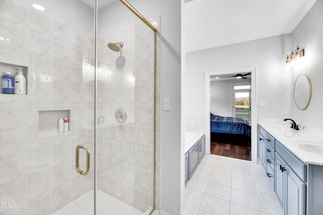 390 Lake Magnolia Way, Smithfield, NC 27577 - full bath featuring double vanity, ensuite bath, a shower stall, tile patterned flooring, and ceiling fan
