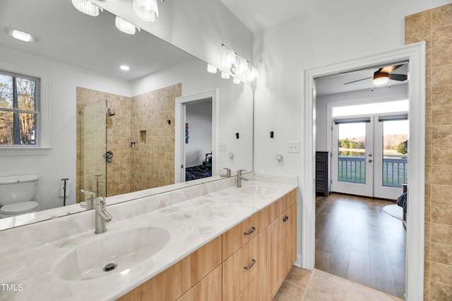 390 Lake Magnolia Way, Smithfield, NC 27577 - full bath with ensuite bathroom, double vanity, tiled shower, french doors, and toilet