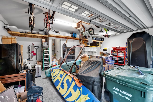 390 Lake Magnolia Way, Smithfield, NC 27577 - garage with a garage door opener and black fridge