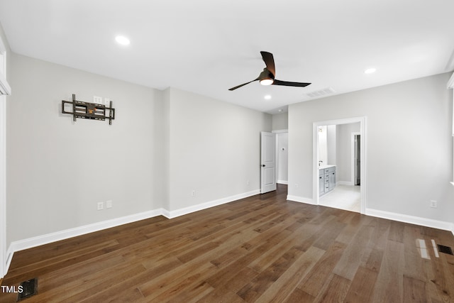 390 Lake Magnolia Way, Smithfield, NC 27577 - unfurnished bedroom featuring wood finished floors, baseboards, recessed lighting, ensuite bathroom, and ceiling fan