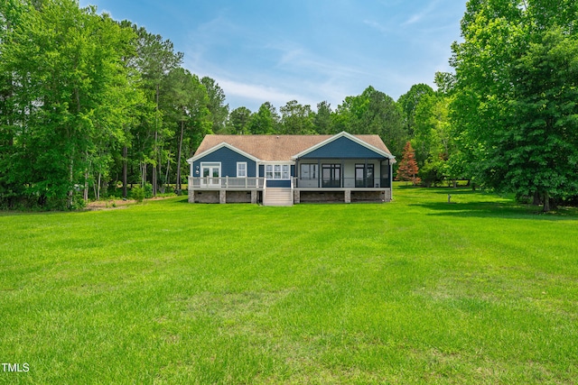 390 Lake Magnolia Way, Smithfield, NC 27577 - rear view of house with a lawn, a sunroom, and a wooden deck