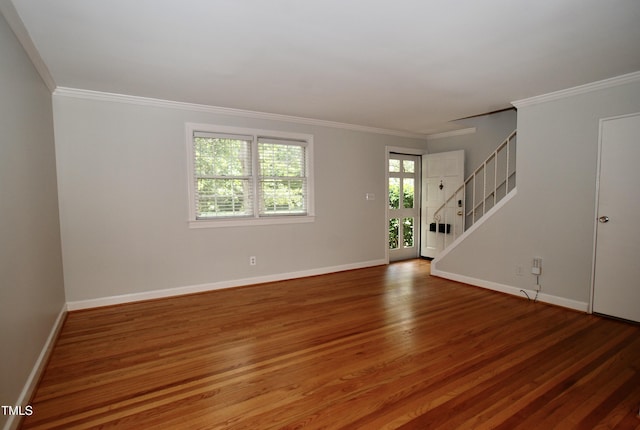 1908 Smallwood Dr, Raleigh, NC 27605 - unfurnished room with stairway, wood finished floors, baseboards, and ornamental molding