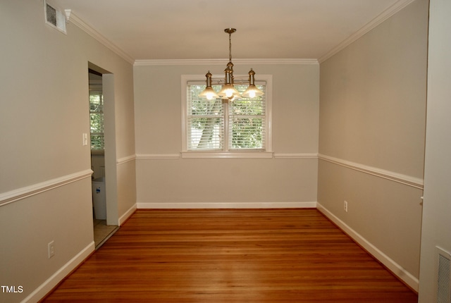 1908 Smallwood Dr, Raleigh, NC 27605 - spare room featuring a chandelier, plenty of natural light, wood finished floors, crown molding, and baseboards