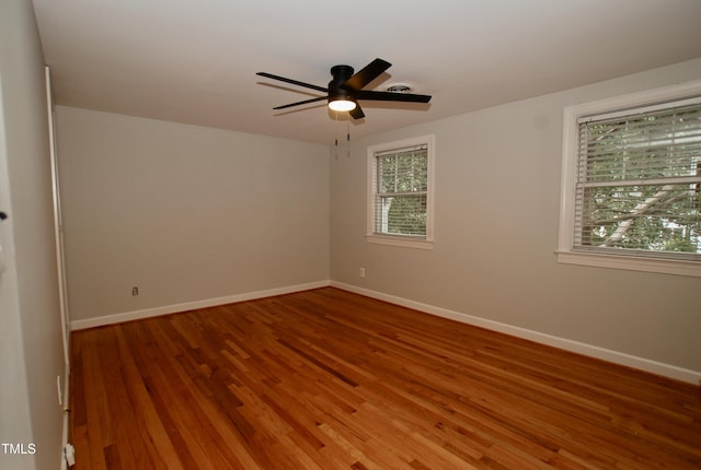 1908 Smallwood Dr, Raleigh, NC 27605 - unfurnished room featuring wood finished floors, baseboards, and ceiling fan