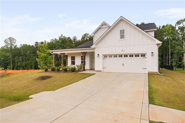 25 Vast View Way, Youngsville, NC 27596 - modern farmhouse with board and batten siding, driveway, a front yard, and a garage