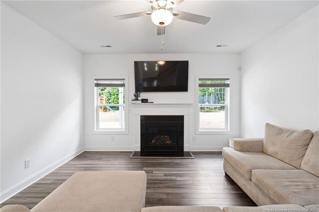 25 Vast View Way, Youngsville, NC 27596 - living room with plenty of natural light, a fireplace with flush hearth, baseboards, and a ceiling fan