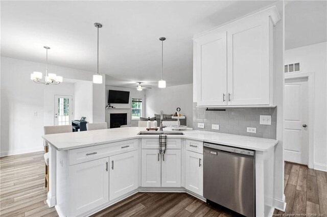 25 Vast View Way, Youngsville, NC 27596 - kitchen featuring stainless steel dishwasher, a sink, a peninsula, and white cabinets