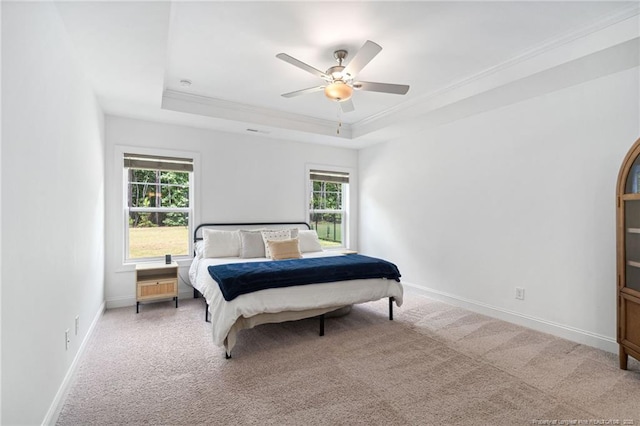 25 Vast View Way, Youngsville, NC 27596 - carpeted bedroom featuring a raised ceiling, baseboards, a ceiling fan, and ornamental molding