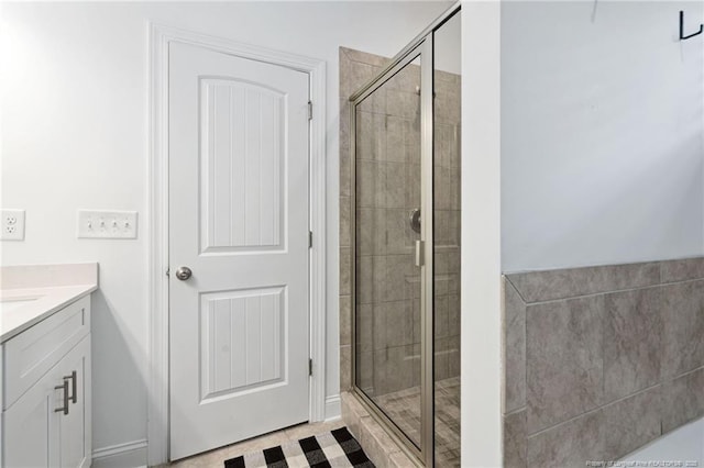 25 Vast View Way, Youngsville, NC 27596 - bathroom featuring a shower stall, vanity, and baseboards
